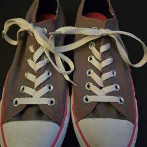 Grey Converse with pink stitching. In great...